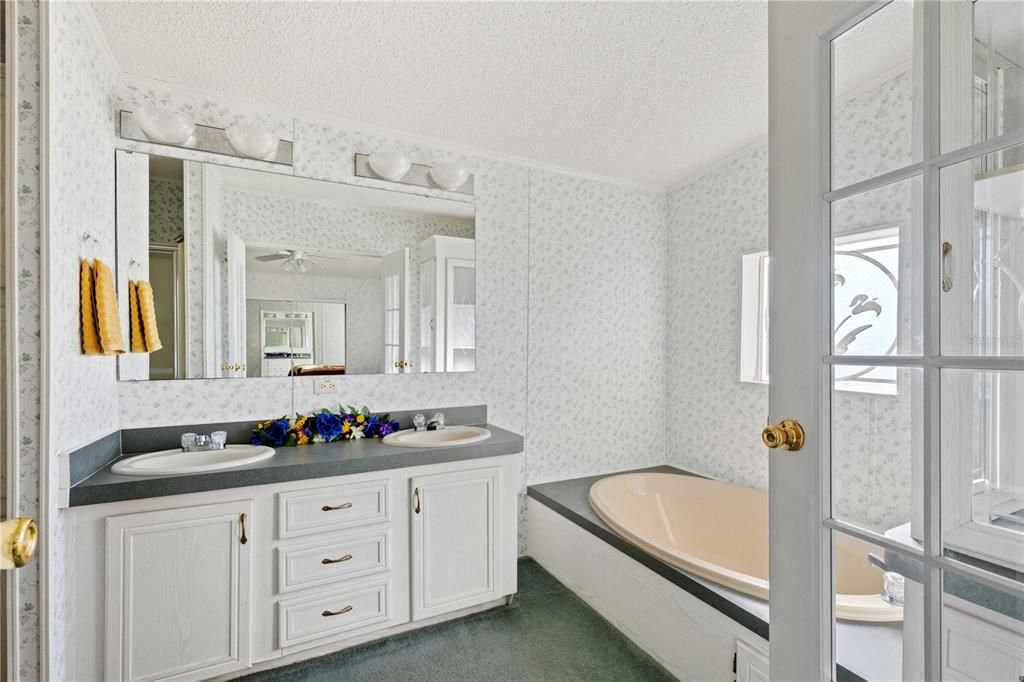 Primary bath has double vanity, step-in shower and much more.