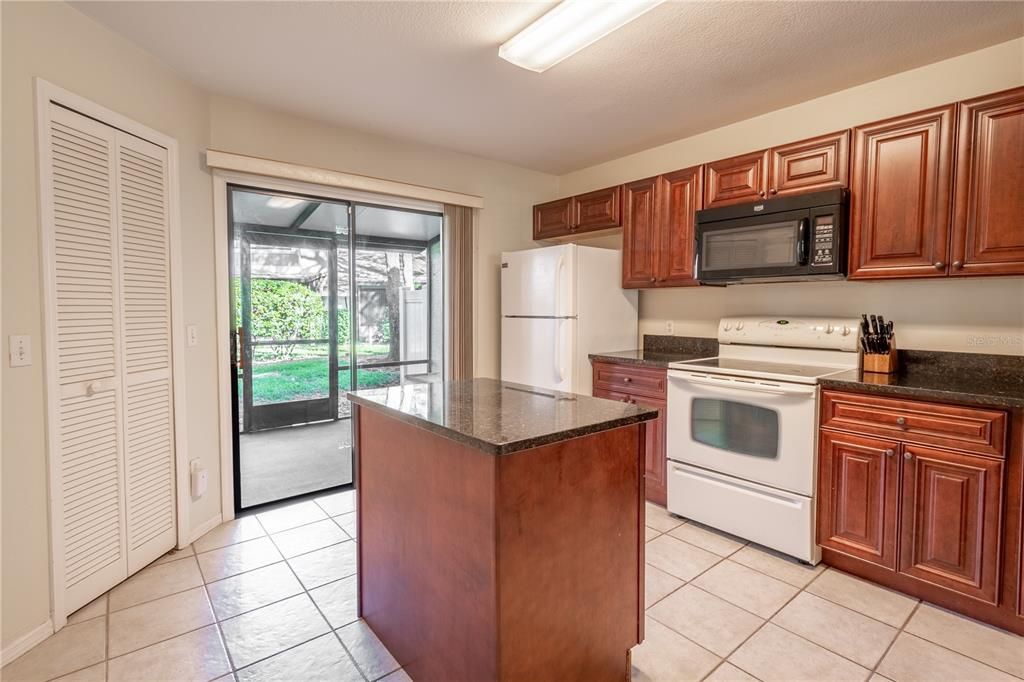 Sliding glass fdoors lead the the screen in porch from the kitchen.