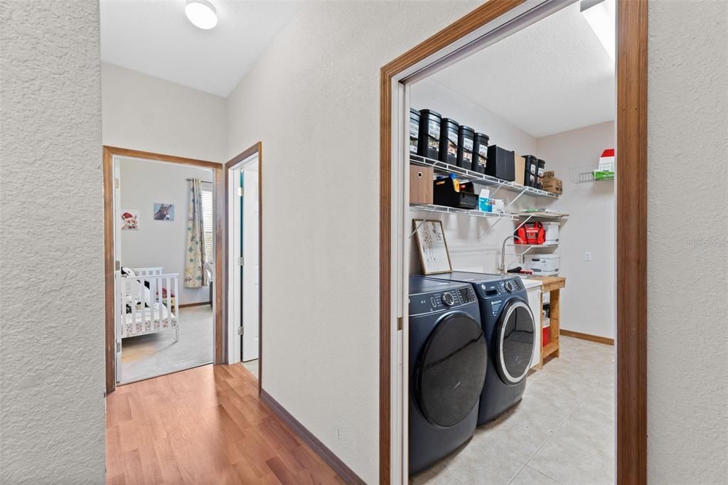 Laundry room leading to garage