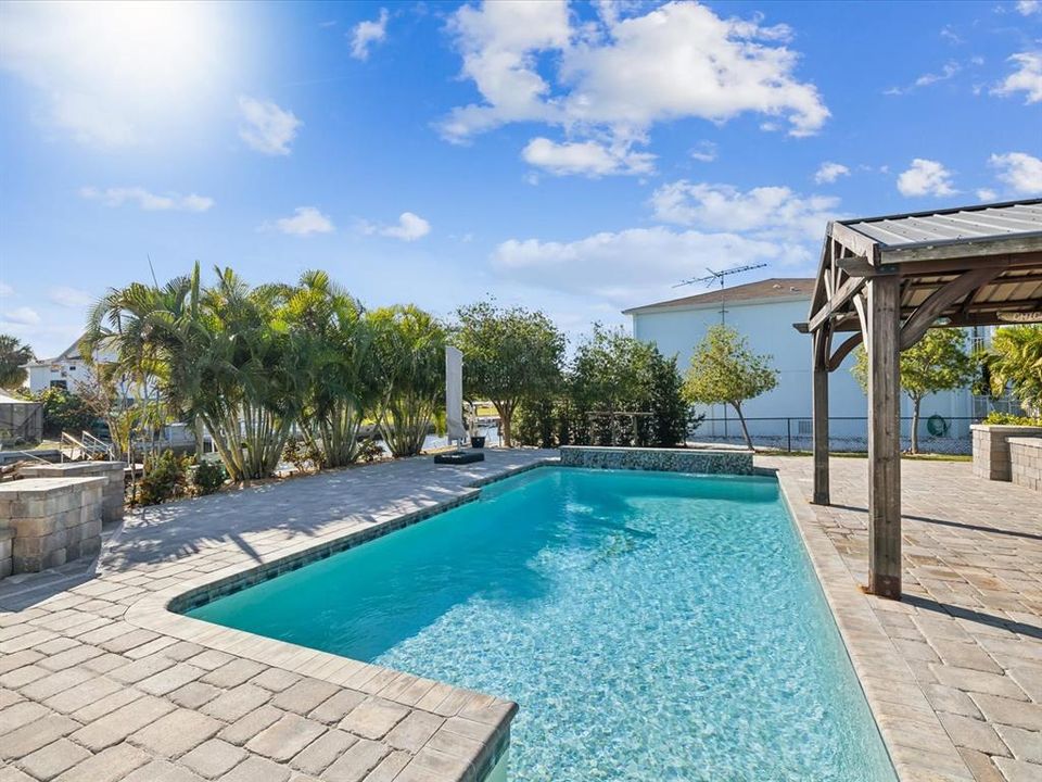 Salt water heated / cooled pool with waterfall and cabana