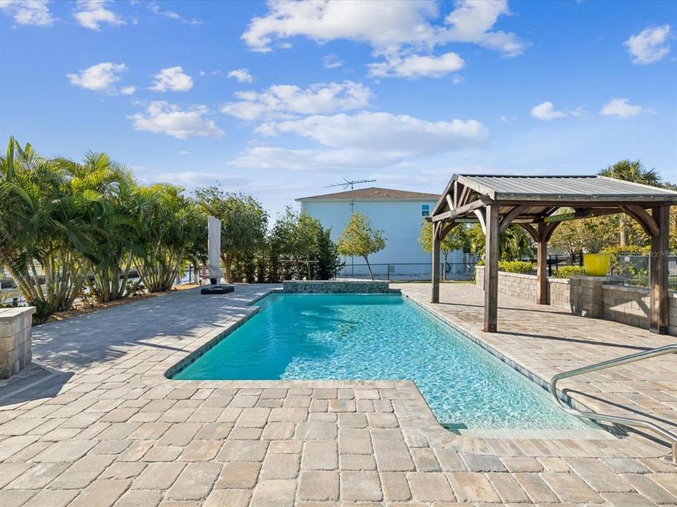 Salt water heated / cooled pool with waterfall and cabana