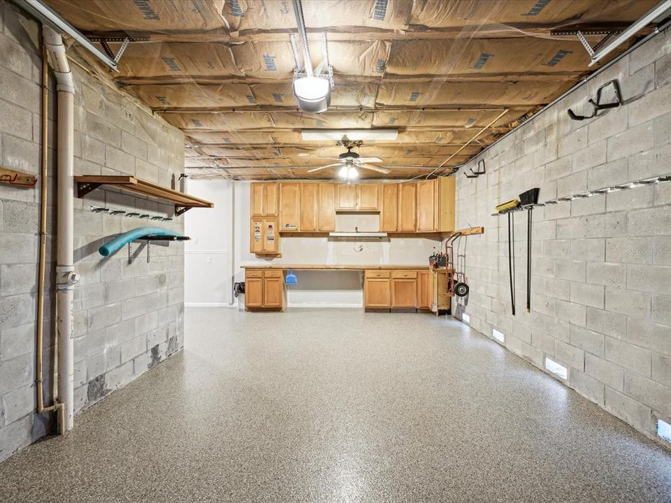 Right side garage with work bench and shelving