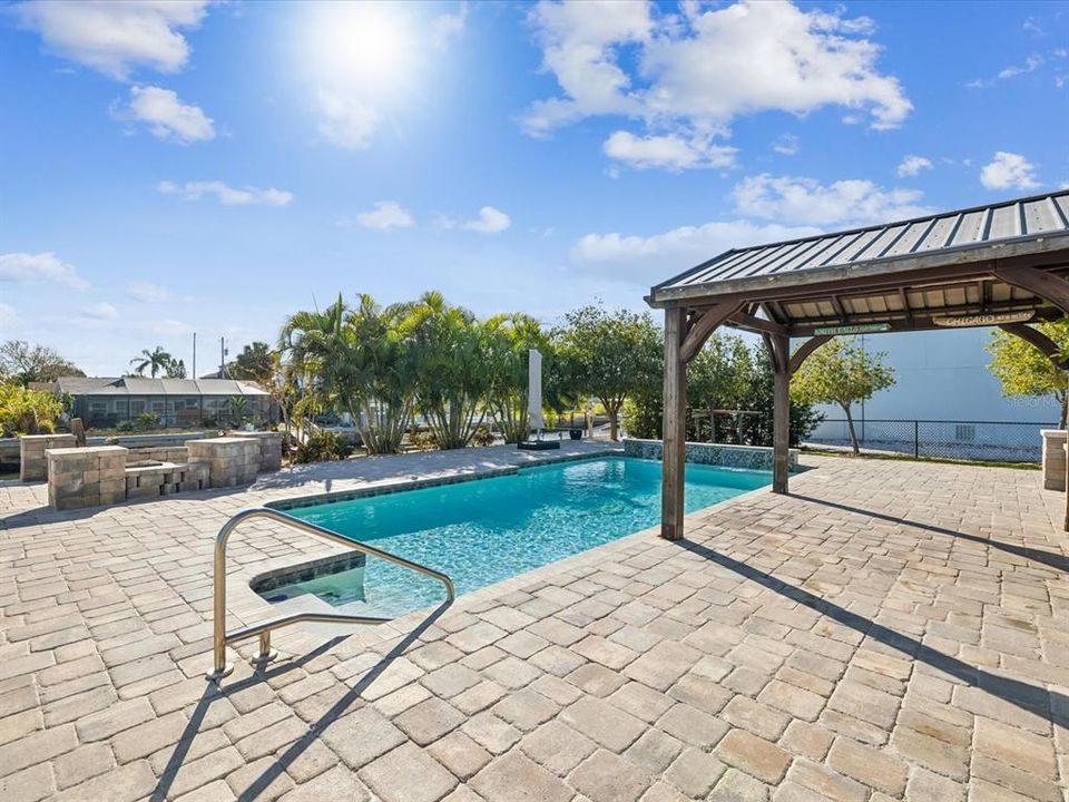 Salt water heated / cooled pool with waterfall and cabana