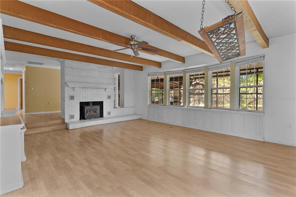 Great room with fireplace and bay windows