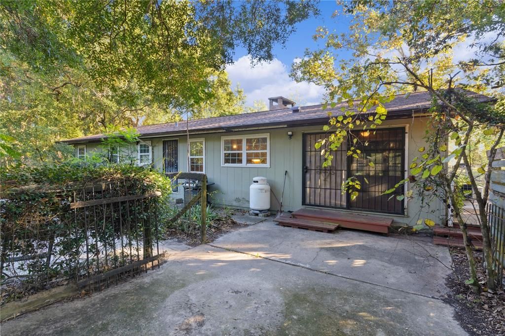 Back of home with patio off living room / den