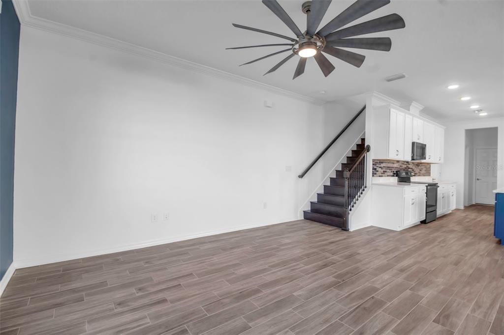 Staircase to upper floor is placed behind the kitchen vs other townhomes that have stairs right inside the door