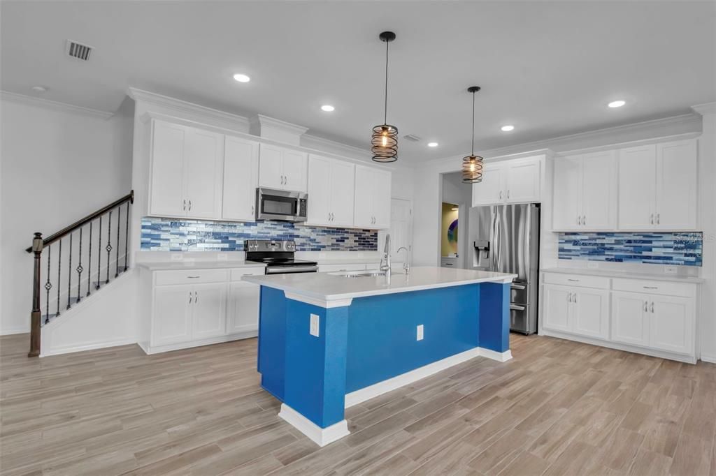 Kitchen includes the Higher-end refrigerator- room for at least 3 counter stools