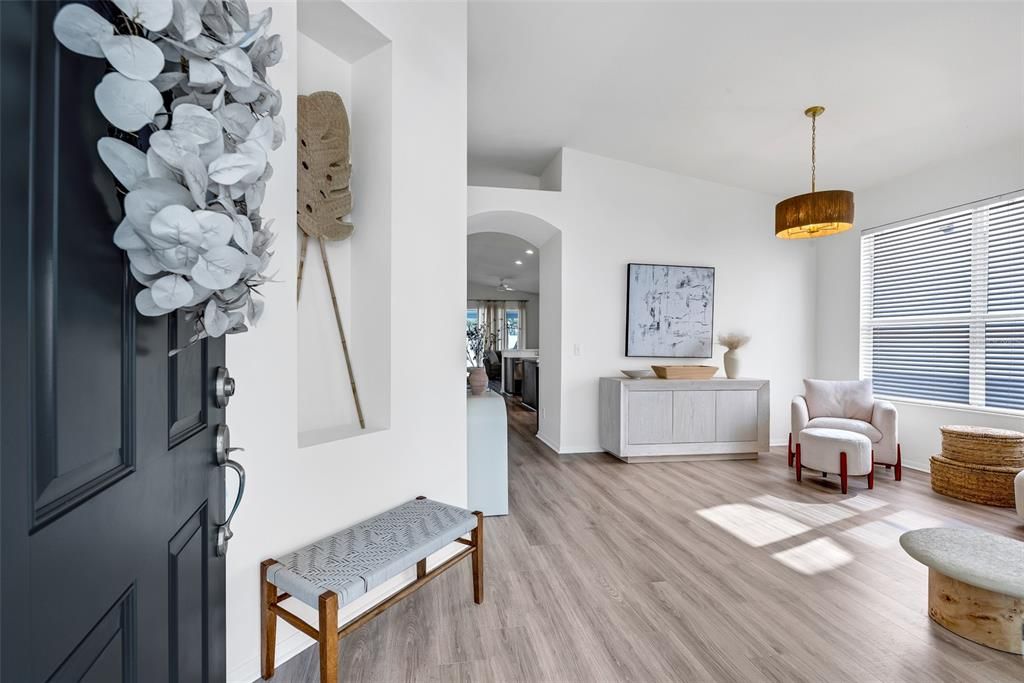 As you enter through the foyer, you’ll be immediately drawn to the open-concept living space.