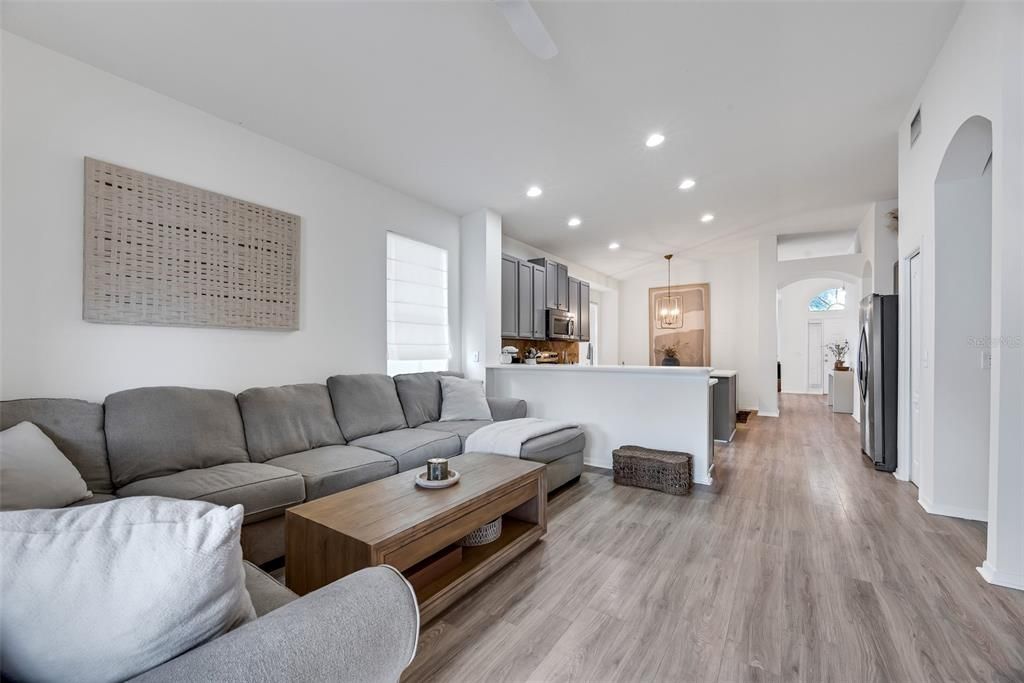 Whether you're enjoying casual meals or chatting with family while cooking, the breakfast bar provides a great spot to gather and adds an element of functionality without compromising the open feel of the family room.