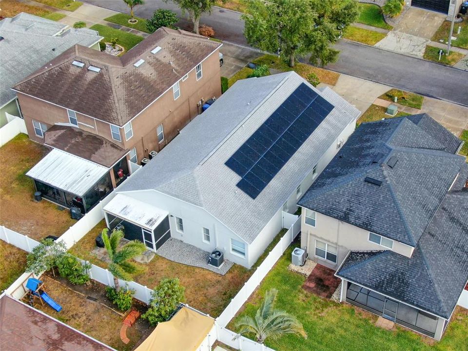 Aerial view of home with PHOTOVOLTAIC SOLAR PANELS (installed March 2024)