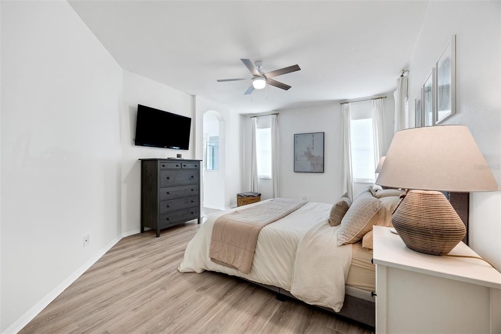 The spacious primary suite is a serene retreat, complete with an en-suite bathroom and walk-in closet.