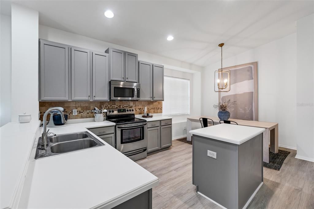 Ample Corian countertops make meal prep a breeze.