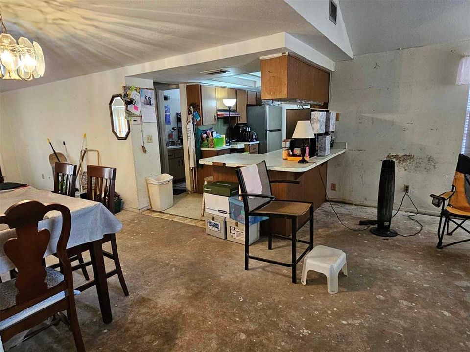 kitchen opens to family room living room and dining room