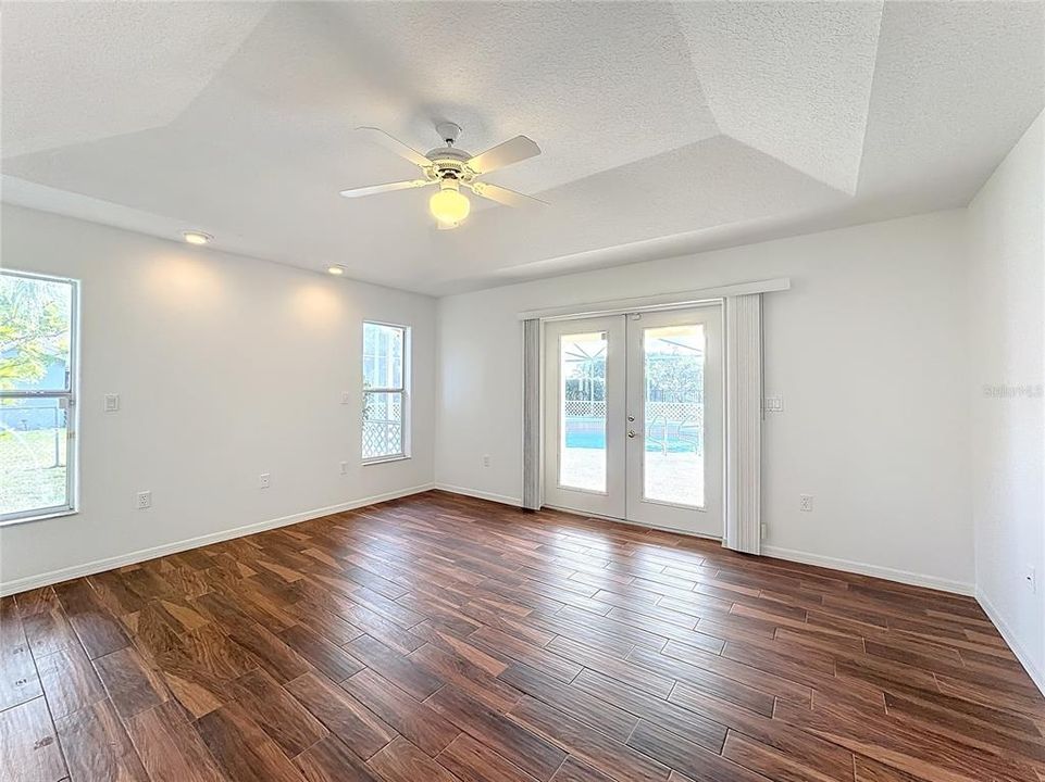 Primary bedroom with French Doors to the pool