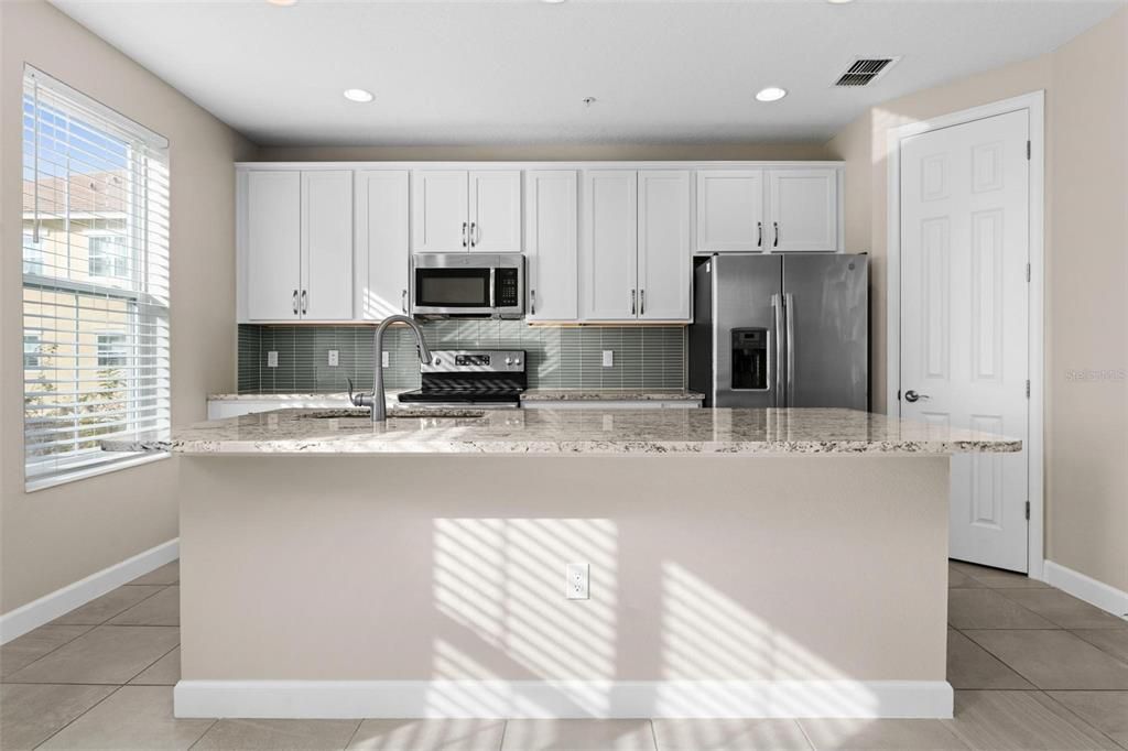 Kitchen island with plenty of room for additional seating.