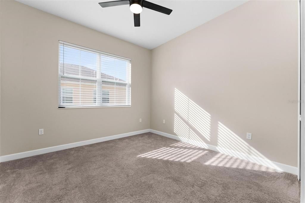 Spacious area and oversized window in bedroom 3