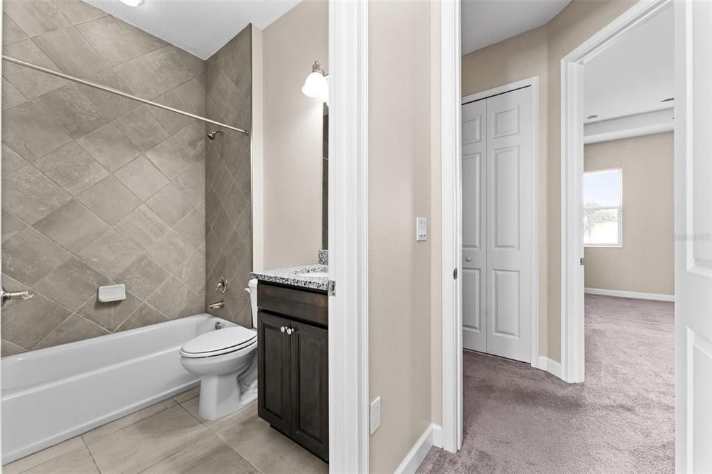 Beautiful granite counters and undermount sink in bedroom 3's private bath.