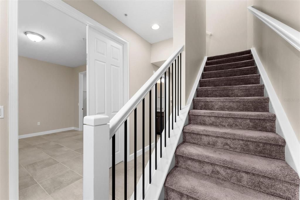 Stairs to the 2nd floor also features under stair storage.