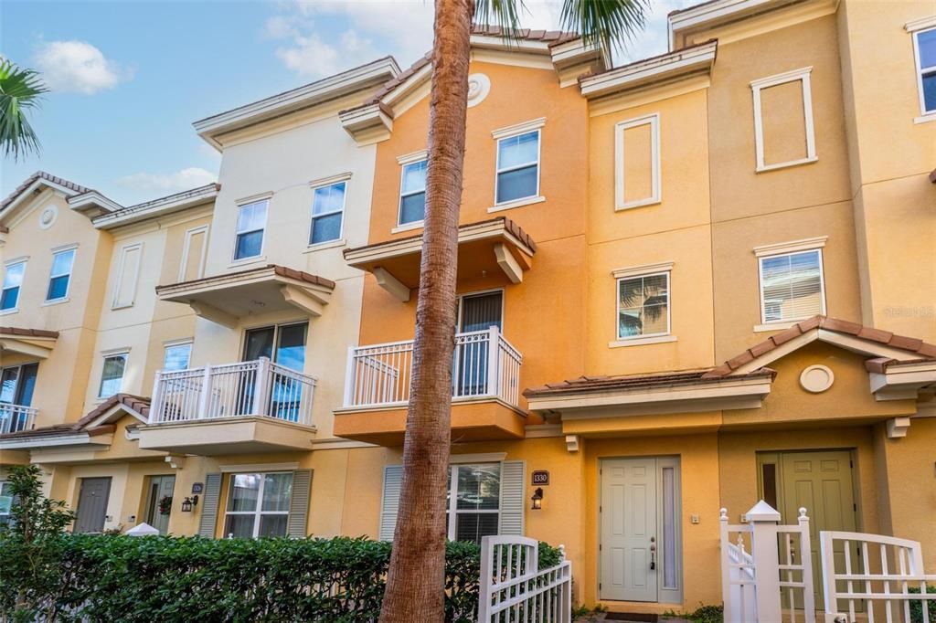 Lovely 3 story townhouse with private courtyard with gate.