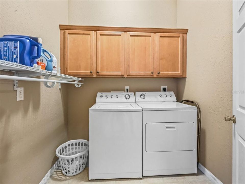 Inside laundry rm w/cabinets & shelf