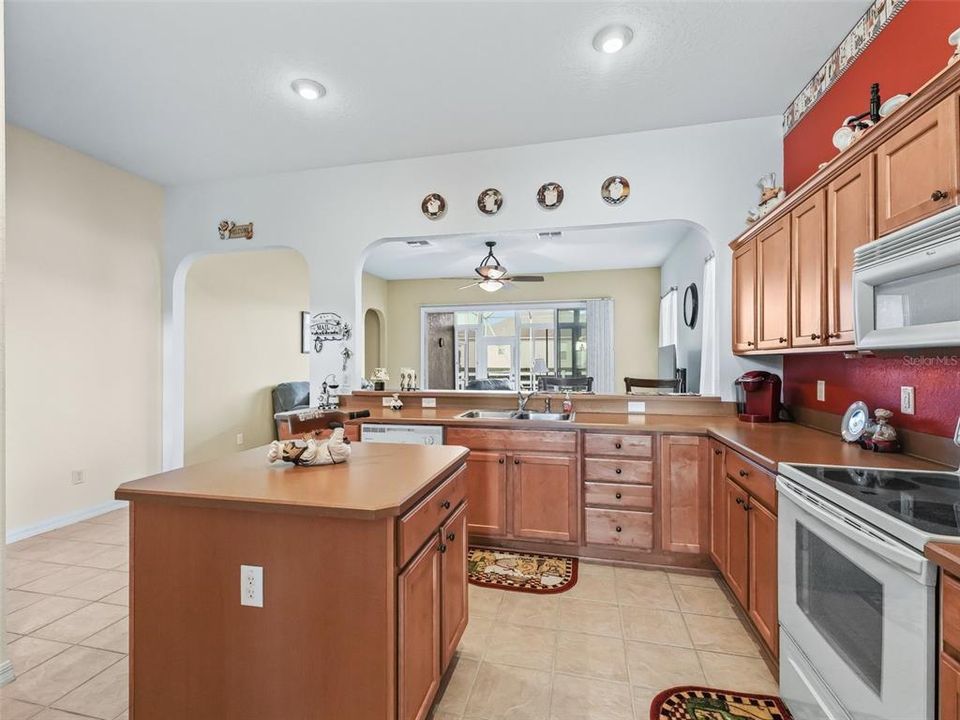 Kitchen w/Island & Ceramic tile flooring