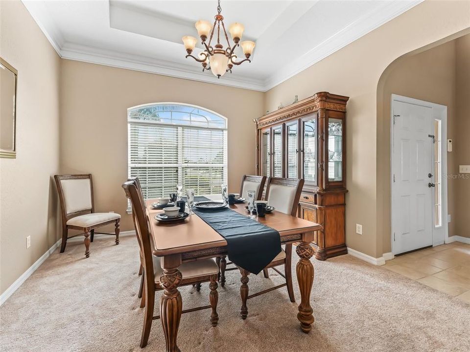 Dining rm w/Gorgeous upgraded light fixture