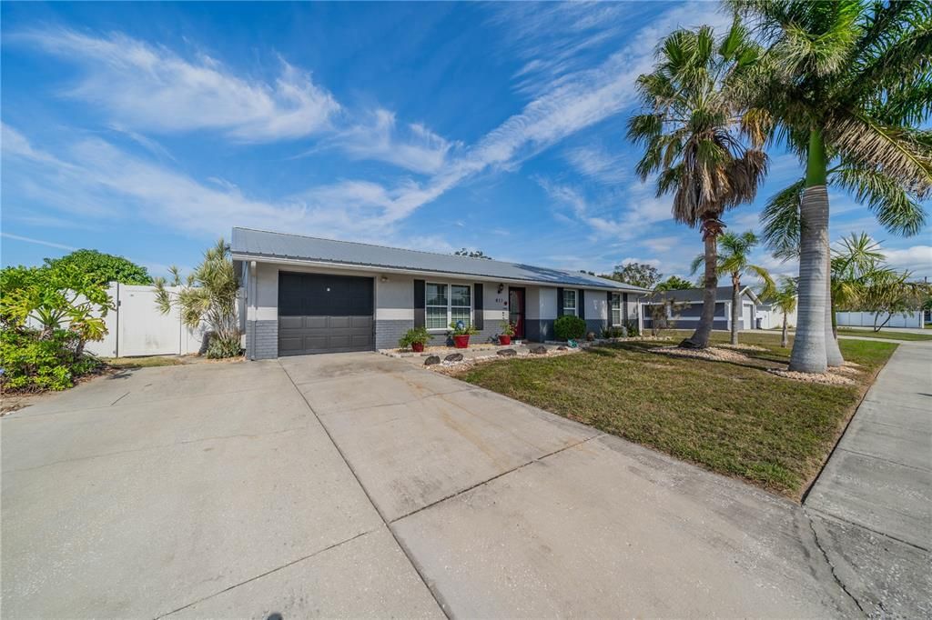 SINGLE ATTACHED GARAGE WITH PLENTY OF PARKING ON DRIVEWAY