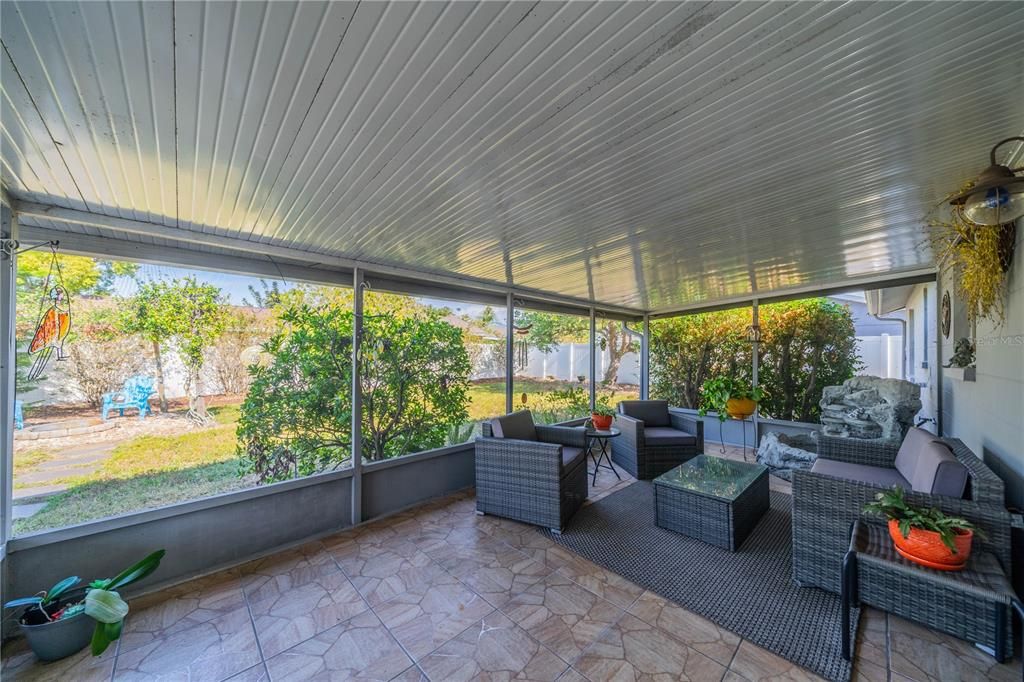 A BEAUTIFUL SETTING OFF YOUR SCREENED LANAI TO YOUR PRIVATE GARDEN