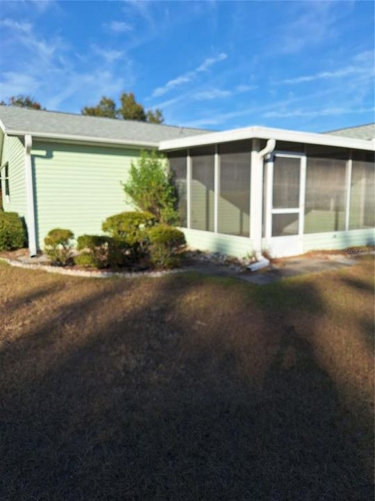 SCREENED PATIO OFF BACK OF HOUSE