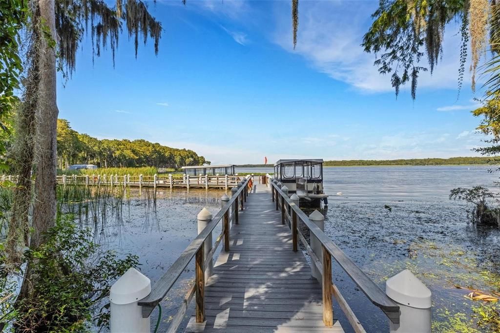 Lake Tarpon Lodge connected to RV lot & boat ramp by an open dock & fishing pier~