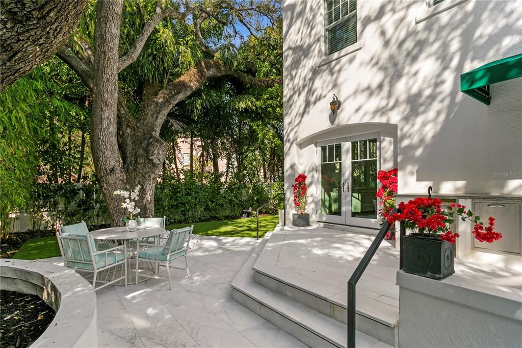 Gorgeous French doors lead you out to the private oasis backyard where you will find the perfect place to entertain under the grand oaks shade.