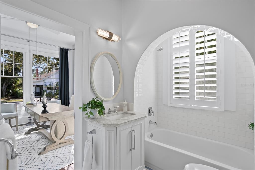 Charming hall bath with period tub/shower combination.