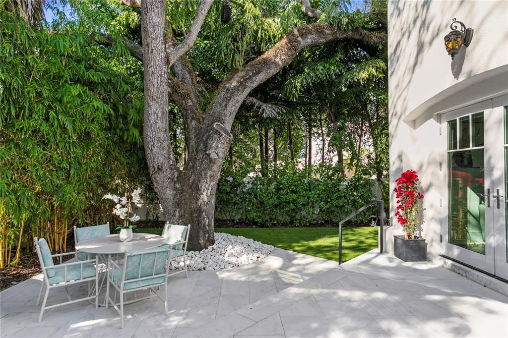 Gorgeous French doors lead you out to the private oasis backyard where you will find the perfect place to entertain under the grand oaks shade.