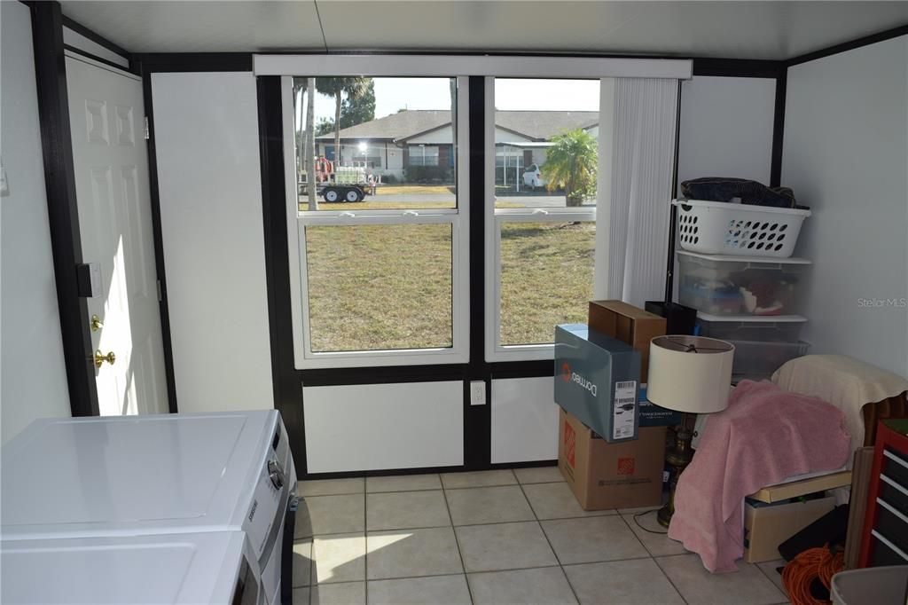 New enclosed porch with 1 year old washer and dryer