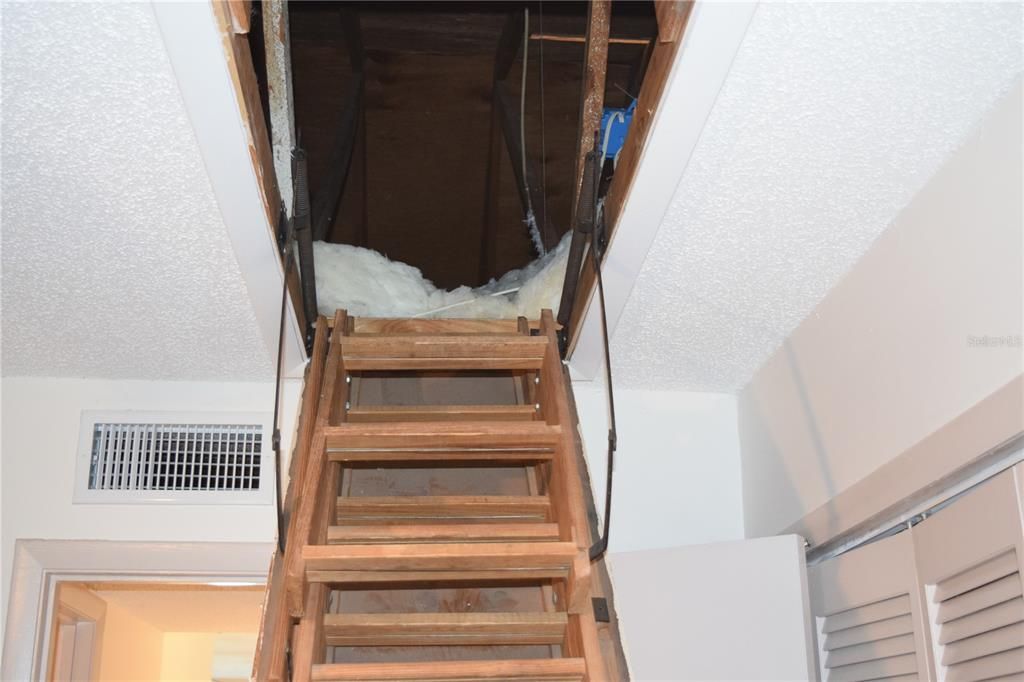 Bedroom has attic access for additional storage