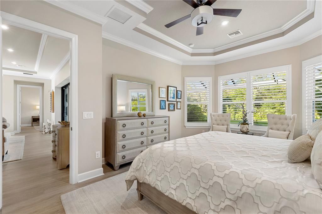 Owner's suite featuring tray ceilings and crown molding.