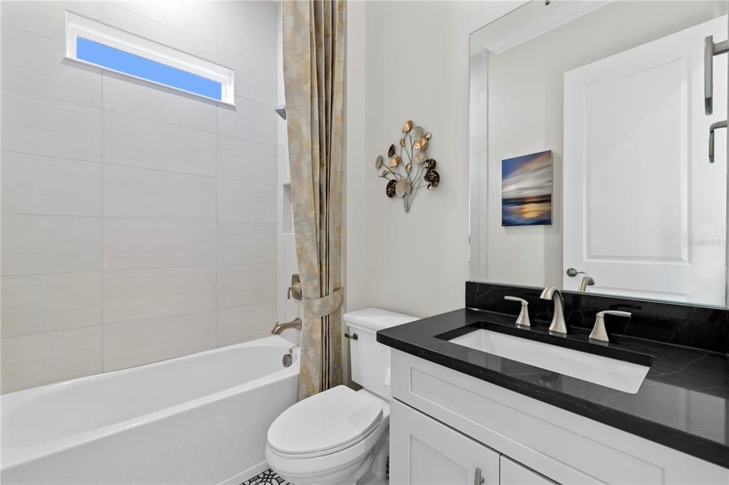 Guest Bath featuring bathtub.