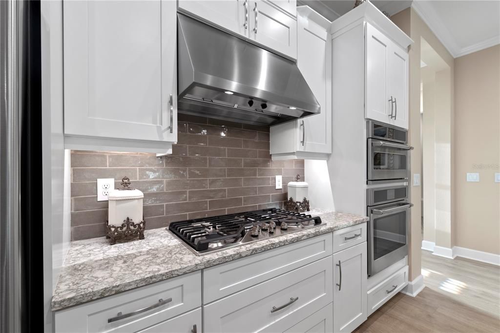 Gas cooktop and sleek shaker cabinets.