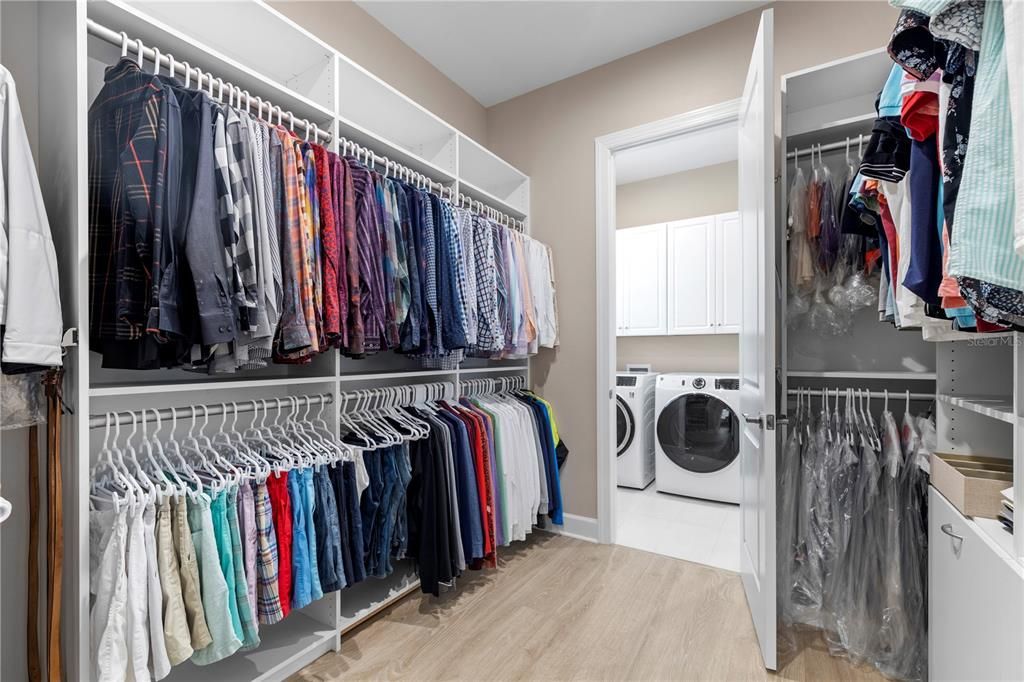 Owner's suite closet creates a passage way directly to the laundry room.