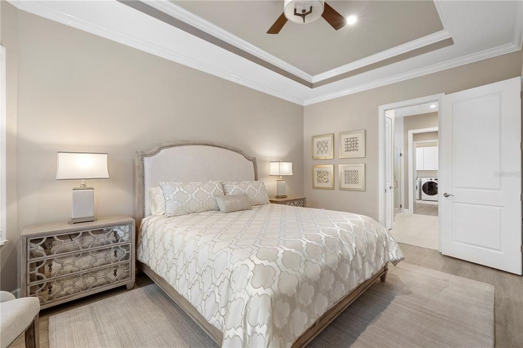 Owner's suite featuring tray ceilings and crown molding.