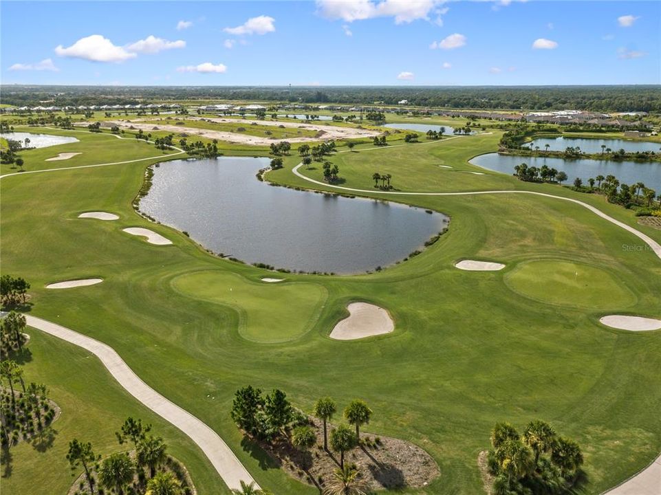 Community photo featuring 18-hole championship golf course.