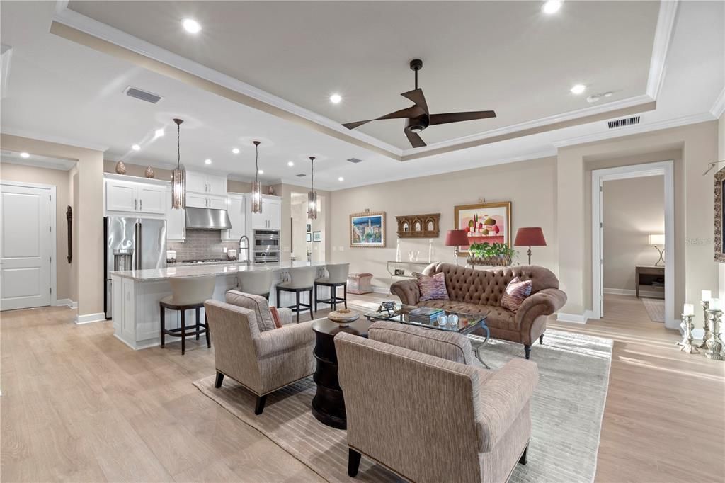 Tray ceilings and crown molding flow throughout the entire home.