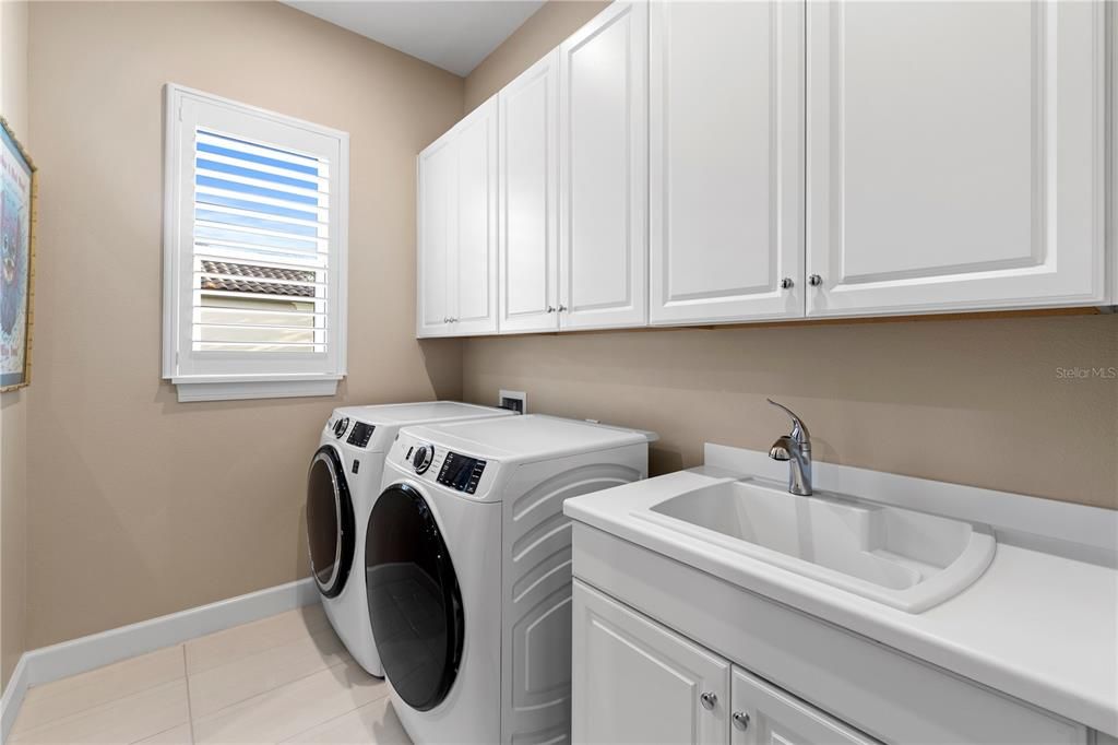 Laundry room off the Owner's suite closet.