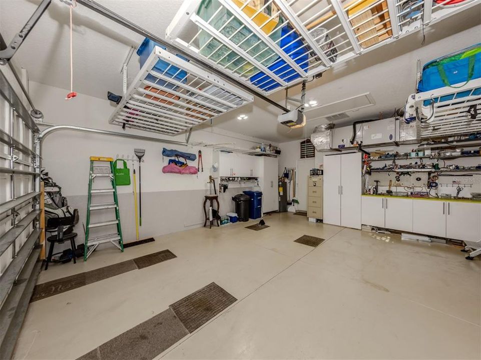 Garage with work bench and over head storage