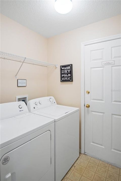 Laundry room and entrance to garage