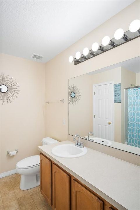 Master Bathroom with tub/shower combo and linen closet