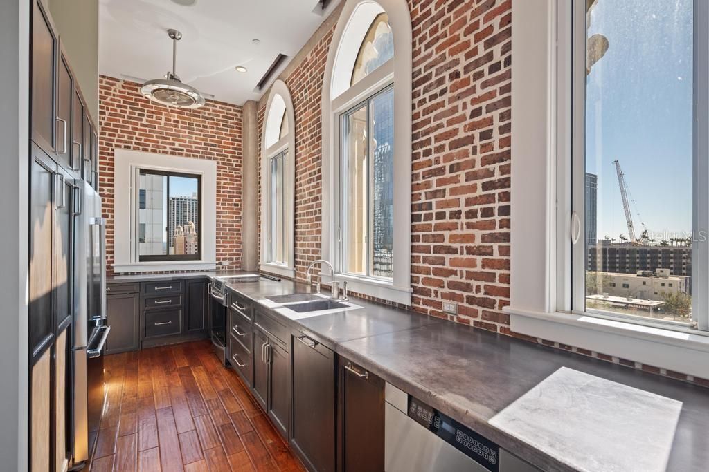 Galley Kitchen with concrete countertops