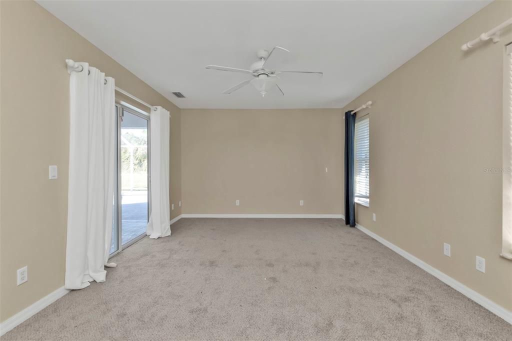 Master bedroom features private sliding doors to pool.