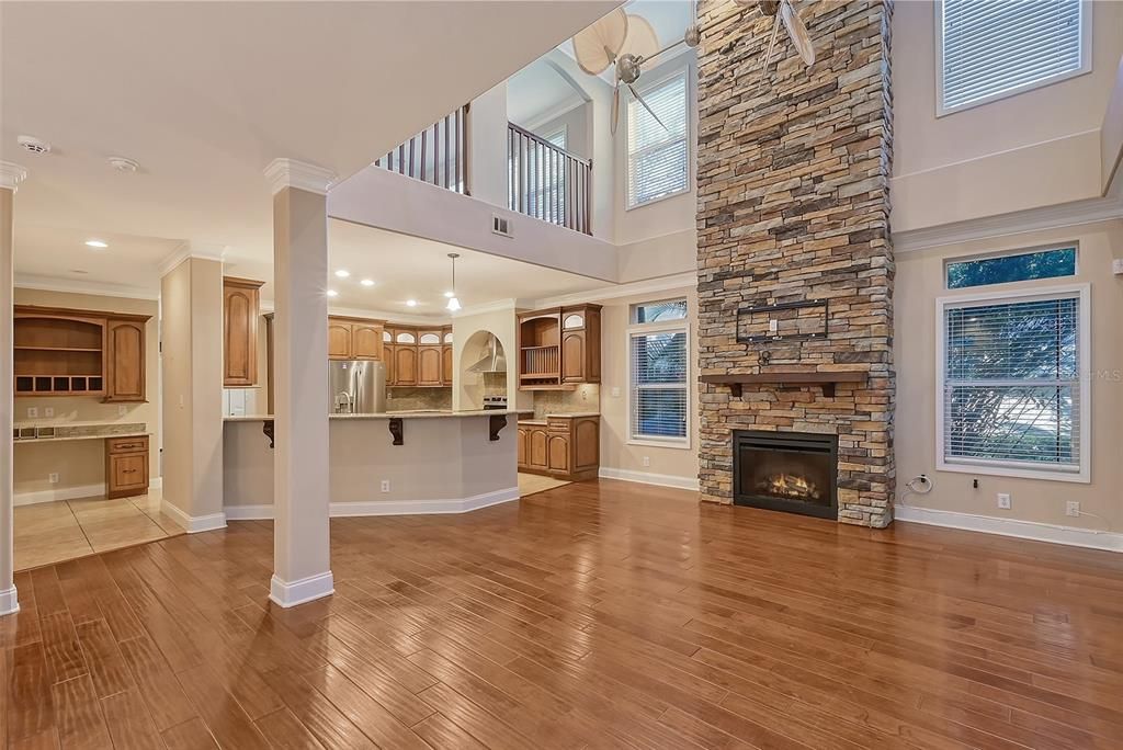 Open Concept Display of Family Fireplace room, Kitchen, Dining Room and Desk built-in.