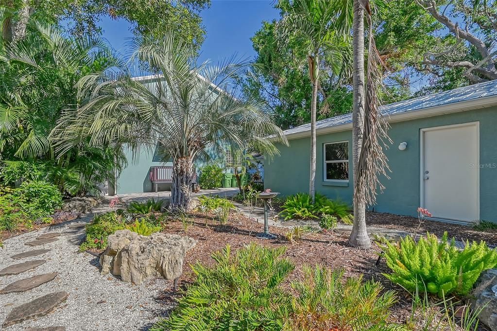 Nature Trail view - Rear of Garage - lush landscaping.